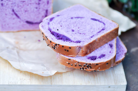 loaf of bread ,sweet potato bread with sesame toppingの写真素材