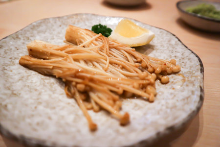 stir-fried golden needle mushroom or stir-fried mushroom and lemonの写真素材