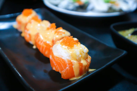 maki or salmon maki or sushi or salmon rolls, Japanese rolls with shrimp egg topping or sushiの写真素材