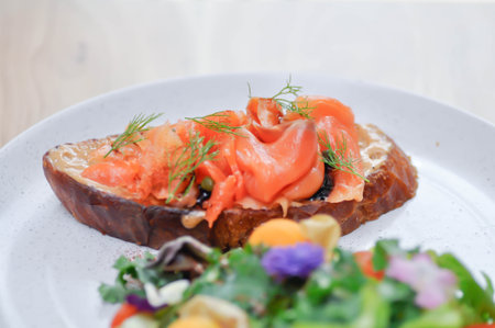 salmon canape or bread with salmon and caviar topping ,saladの写真素材