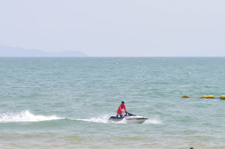 driving jet ski in the sea and the beach or sea background or beach background