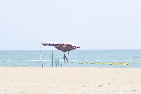 beach, sea and sun or sea background or parasol and beach backgroundの写真素材