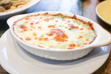 Baked spinach or Baked spinach with cheese for serveの写真素材