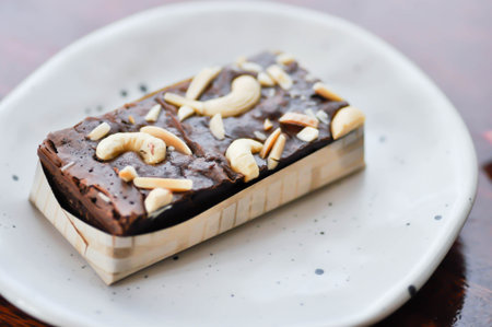 brownie, chocolate cake or brownie with almond topping