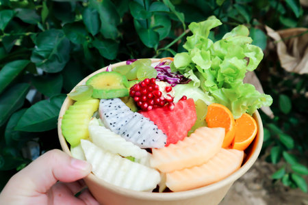 fruit and vegetable salad or cantaloupe, dragon fruit and lettuce salad in the boxの写真素材