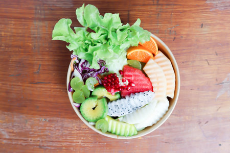 fruit and vegetable salad or cantaloupe, dragon fruit and lettuce salad in the boxの写真素材