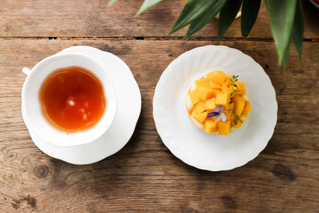 mango cake or mango cheese cake , mango cheese pie and hot tea for serveの写真素材