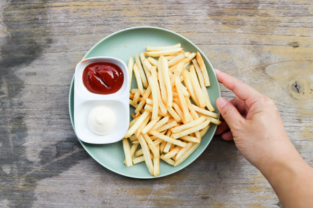 French fries or fried potato , fries with mayonnaise and tomato sauce or catchup