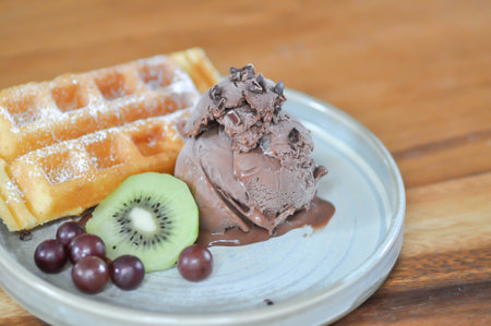 waffle with ice cream and fruit or grape and kiwi fruitの写真素材