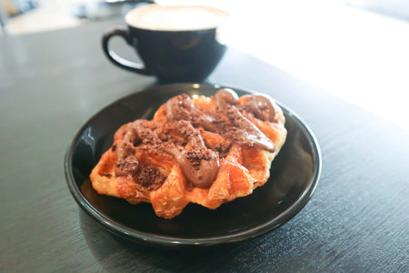 chocolate waffle or waffle with chocolate topping and hot coffeeの写真素材