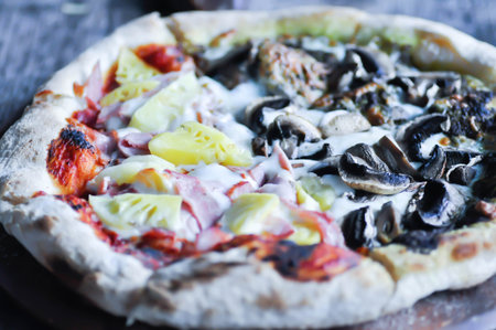 Hawaiian pizza and pesto mushroom pizza ,half and half topping pizza or split half topping pizza or Italian pizzaの写真素材