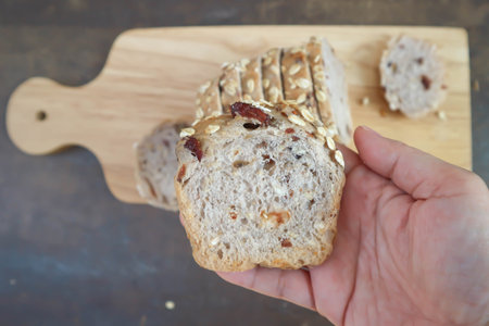 bread , whole wheat bread or sourdough bread or loaf of bread or cranberry and whole grain bread in...
