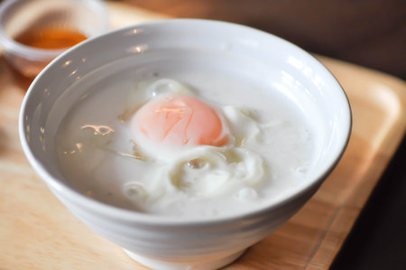 Thai dessert or Thai sweet or Thai sweetmeat with soft boiled egg or scalded egg or parboiled eggの写真素材