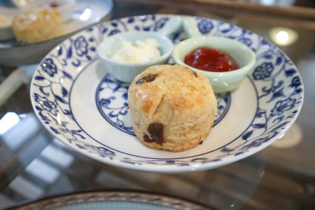 scone , cranberry scone or scone with whipped cream and strawberry jam or strawberry dressingの写真素材