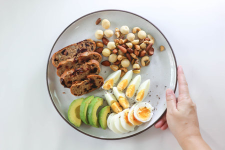 walnut cranberry sourdough bread or cranberry sourdough with boiled egg , avocado and nuts for serveの写真素材