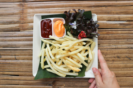 French fries or fried potato , fries with ketchup and cheese dip for serve