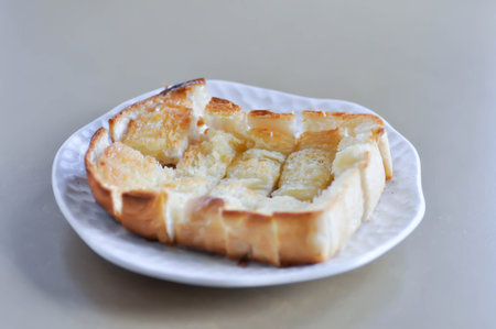 toast or bread with butter topping , toast bread or sliced bread for serve