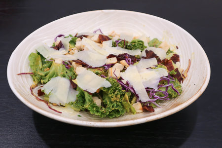 caesar salad or vegetable salad with bacon and cheese for serveの写真素材