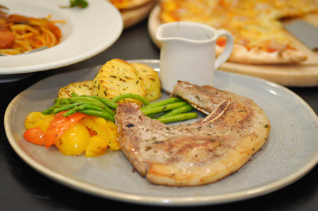 pork steak or grilled pork and salad or pork chop for serveの写真素材