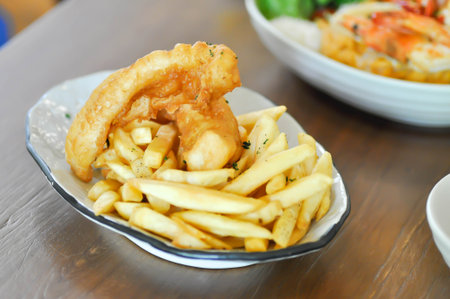 fish and chip or fried fish ,deep fried fish with French fries or fried potatoの写真素材