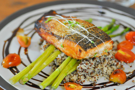 grilled salmon,salmon steak or fish steak and quinoa or rice for serve