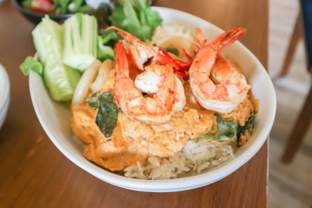 creamy omelet or omelet or omelette or fried egg with shrimp and squid or seafood omelette and rice for serveの写真素材