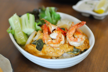 creamy omelet or omelet or omelette or fried egg with shrimp and squid or seafood omelette and rice for serveの写真素材