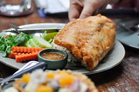fried fish, crispy fish with rice and vegetable or deep fried fish or fish and rice for serve