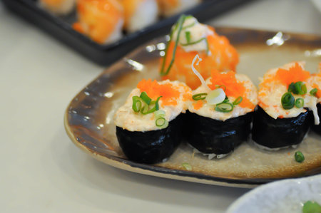 maki , Japanese roll or rice roll or seaweed roll with shrimp egg toppingの写真素材