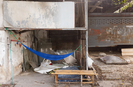 Homeless house with blue hammock and wooden chairの写真素材
