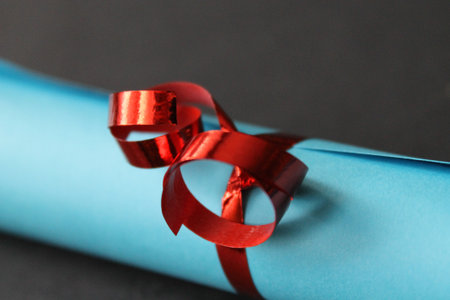 Diploma with red ribbonの写真素材