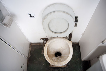 Dirty toilet bowl in a local trainの写真素材