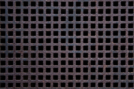 Rusted grid from metal as a background motiveの写真素材
