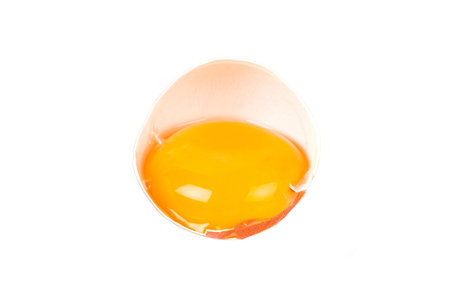 Close-up of an opened egg isolated on white backgroundの写真素材