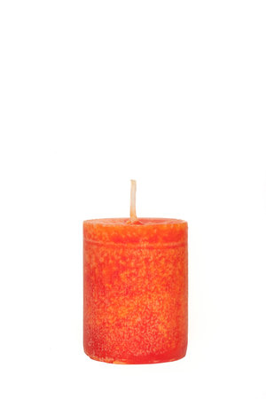 A single burning red candle  isolated in front of white backgroundの写真素材