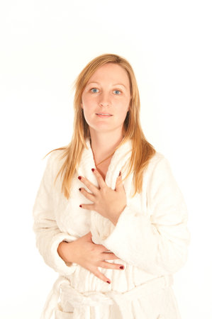 Portrait of a young woman in bathrobe Portrait of a young woman in white bathrobe の写真素材