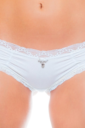 Closeup of a beautiful nude woman in white panties in front of white backgroundの写真素材