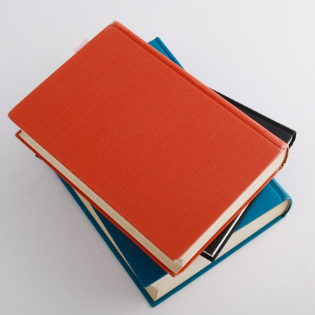 Three books, one red, one black and one blue