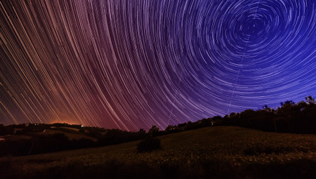 star trails night sky landscapeの写真素材