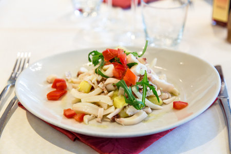 seafood appetizer with vegetables on restaurant tableの写真素材