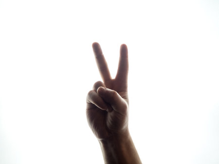 Male hand on white background victoryの写真素材