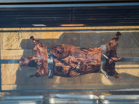 Pig roasting on electric skewer metal in Sochiの写真素材