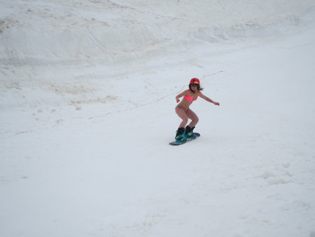 Snowboard water competition girl in swimsuit at the ski resort Gorky Gorod. Russia Sochi 05.11.2019のeditorial素材