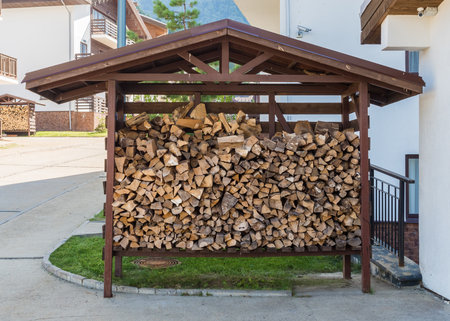 A metal shed for storing firewood outdoors Rosa Khutor. Krasnaya Polyana
