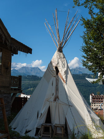 Homemade tent like Indian stands on Rosa Khutor Against the backdrop of beautiful mountainsの写真素材