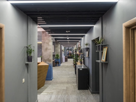 Hotel lobby with gray walls green potted plantsのeditorial素材