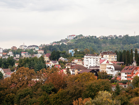 Private houses on background of beautiful autumn trees