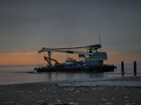 Russia, Sochi 03.10.2019. Self-propelled floating crane Chernomorets-35 evening