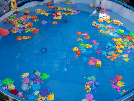 Russia, Sochi 03.10.2019. Figurine Beautiful water pool with fish toys for kidsのeditorial素材
