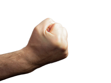 Male brutal hairy hand clenched into a fist on an isolated backgroundの写真素材